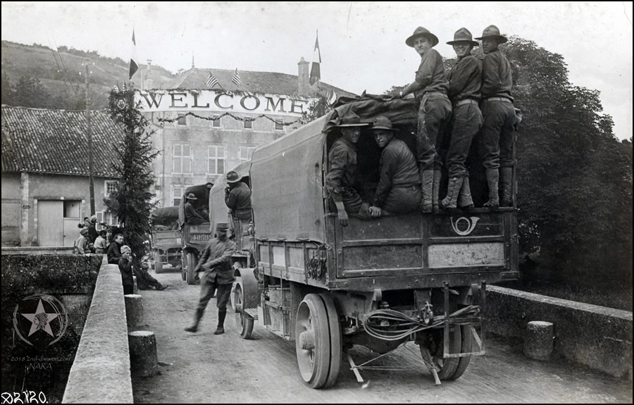 Truck train of U.S. Marines 5th Regt., entering Menaucourt, France. 1917.