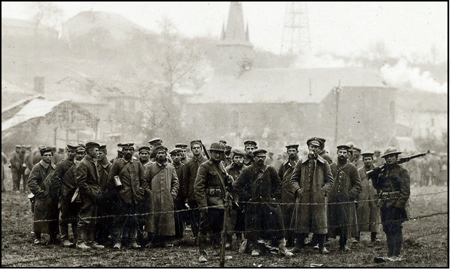 German prisoners guarded by 2nd Div. M.P's awaiting to be escorted to prison camp. Exermont, Ardennes, France. Oct. 2, 1918.