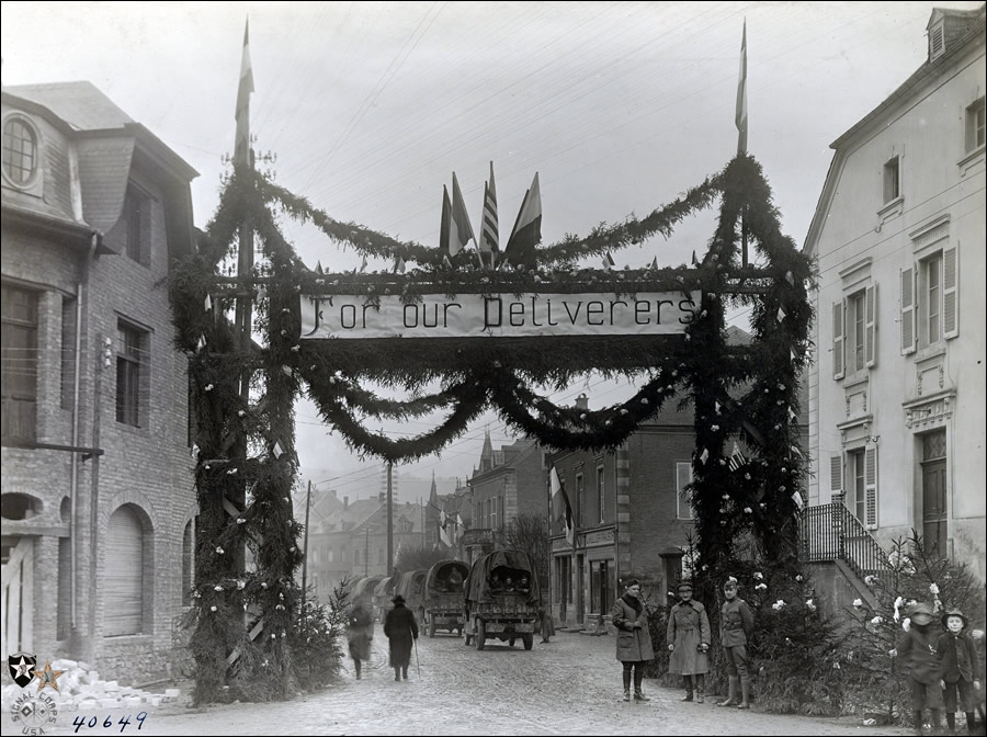 Welcome arch erected in Mersch, Lux., for the American Army of Occupation marching through into Germany. Taken Dec. 3, 1918.