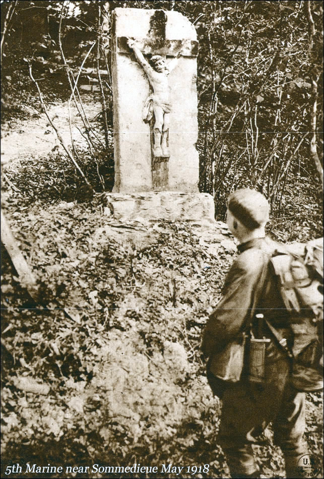 A member of the Fifth Regiment of Marines meditating before a Calvaire near Sommedieue, May 13, 1918