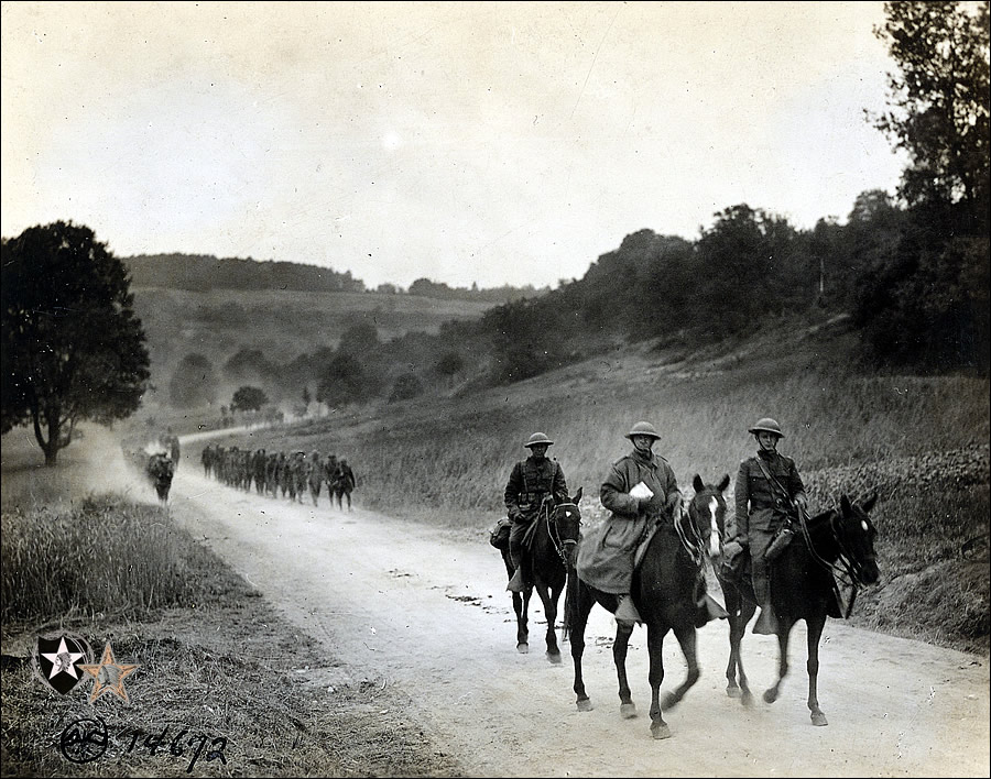 2nd Bn, 6th Marines, on way to rest camp. L to R: Maj. T. C. Holcomb, C.O. & Dr. Capt. G. L. White, near Montreuil. 6-17-18.