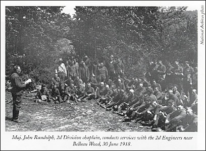 Maj. John Randolph, 2d Division chaplain, conducts
            services with the 2d Engineers near Belleau Wood, 30 June 1918.